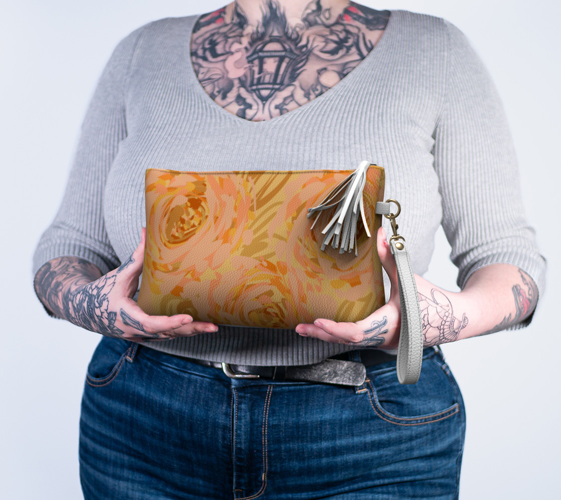 Queen of Petals Apricot Blooms Vegan Leather Clutch held to show 10 inch width scale