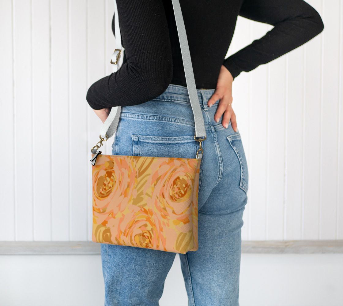 Queen of Petals Apricot Blooms Vegan Leather Crossbody Purse worn with adjustable strap