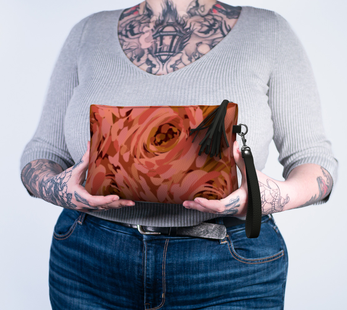 Queen of Petals Coral Bronze Vegan Leather Clutch held in hands showing proportional size