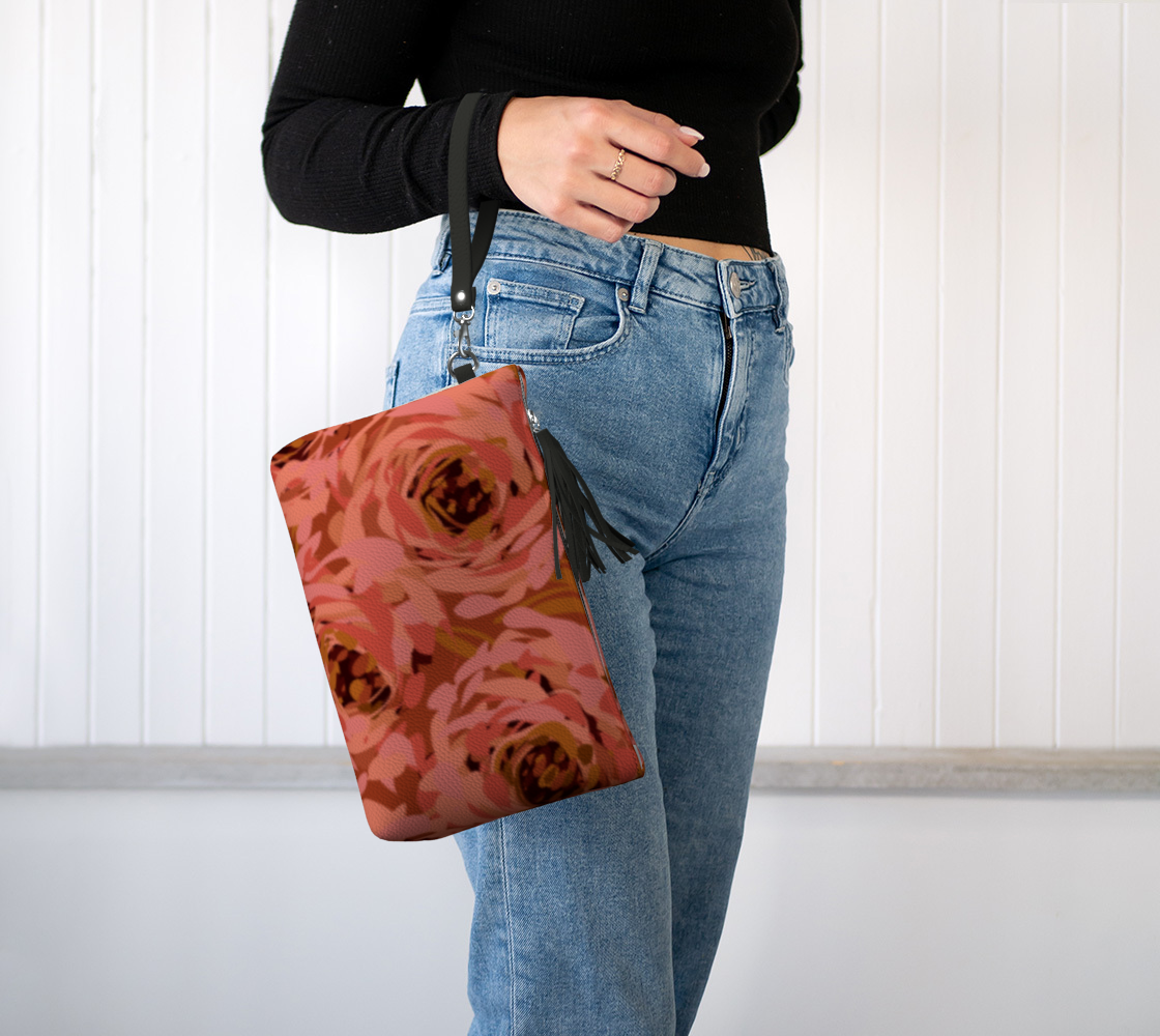 Queen of Petals Coral Bronze Vegan Leather Clutch worn on wrist with detachable strap