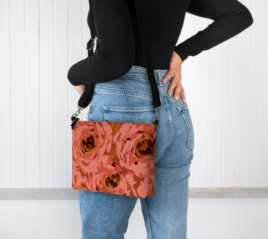 Queen of Petals Coral Bronze Vegan Leather Crossbody worn across shoulder, adjustable strap