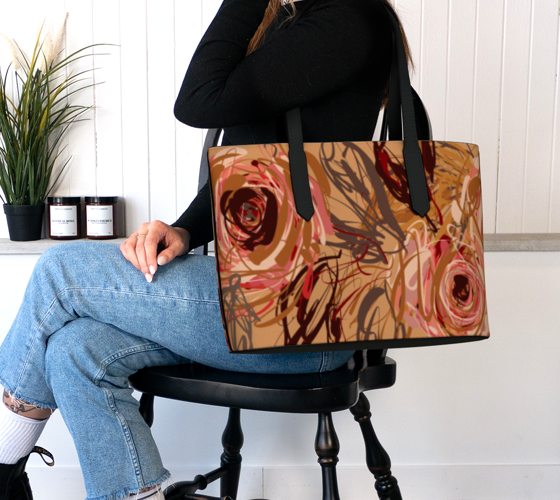 Queen of Petals Vintage Blooms Vegan Leather Tote Bag worn on shoulder fitting 16 inch laptop