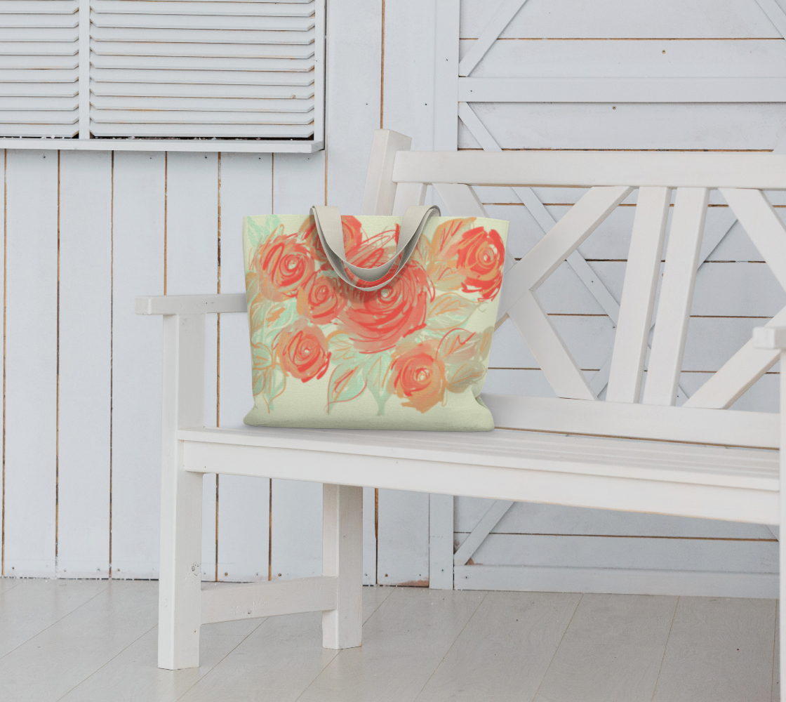 Xyla Sovereign tote bag styled on bench, showcasing oversized design and vibrant coral rose artwork
