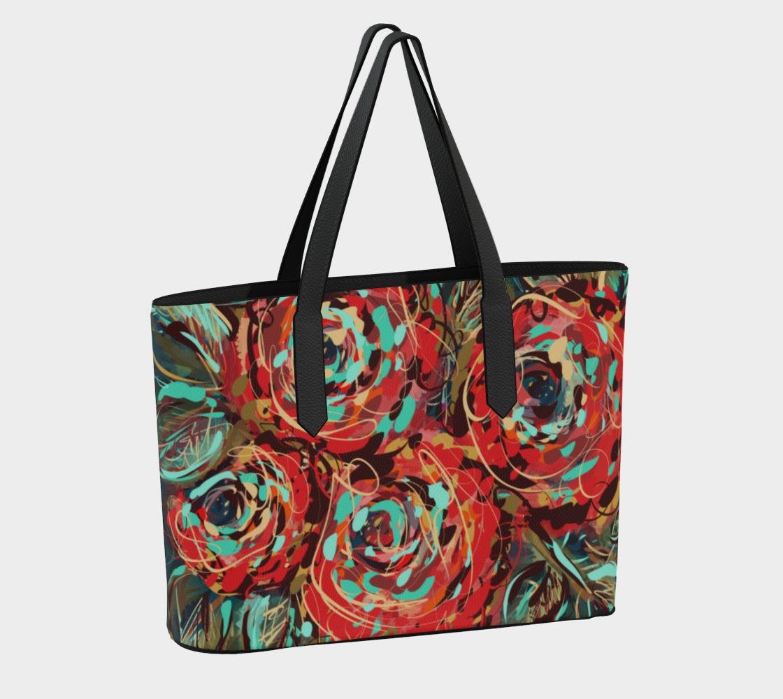 Back view of the Le Rous Collection vegan leather tote bag in floral, showcasing its vibrant red roses and earthy tones. Made from durable vegan pebble leather, this bag features black straps and a secure magnetic snap closure for easy access and everyday use.