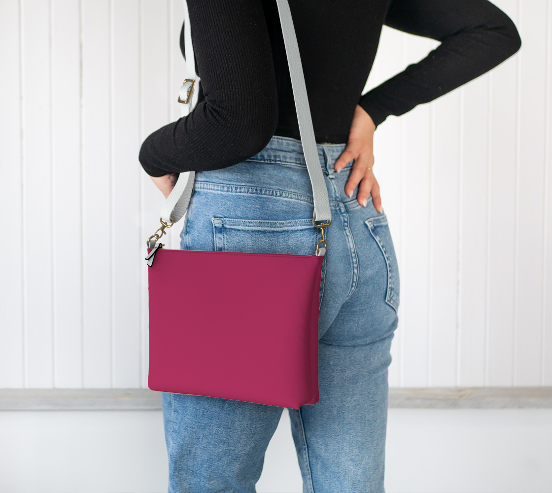 Queen of Petals Berry Cane Dark Berry Crossbody, worn on shoulder showing adjustable strap length