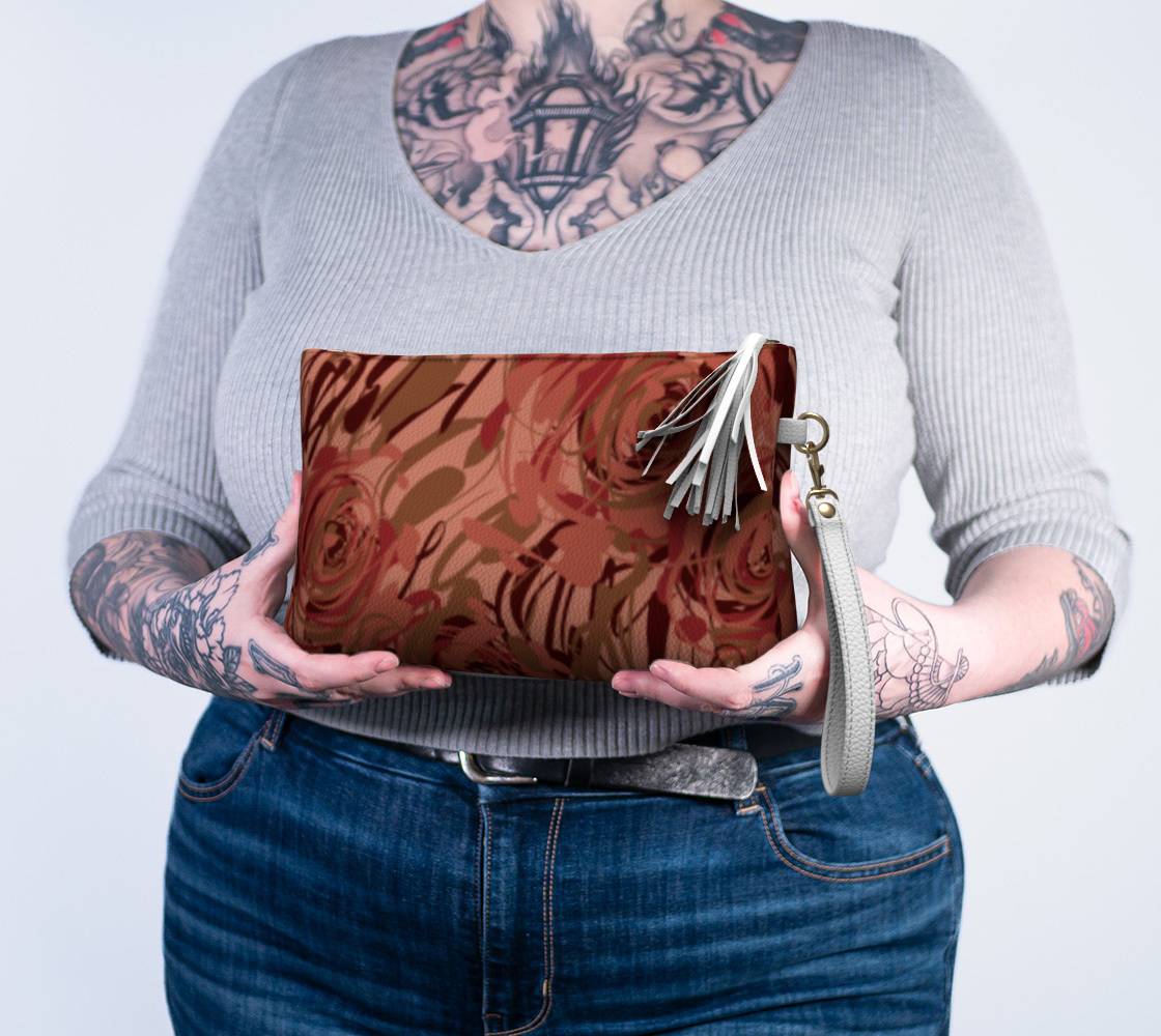 Queen of Petals Blush Pink Vegan Leather Clutch, held in hands, showing compact evening size