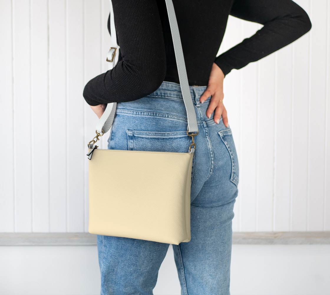Queen of Petals Butter Vegan Leather Crossbody Purse worn on shoulder for hands-free carrying