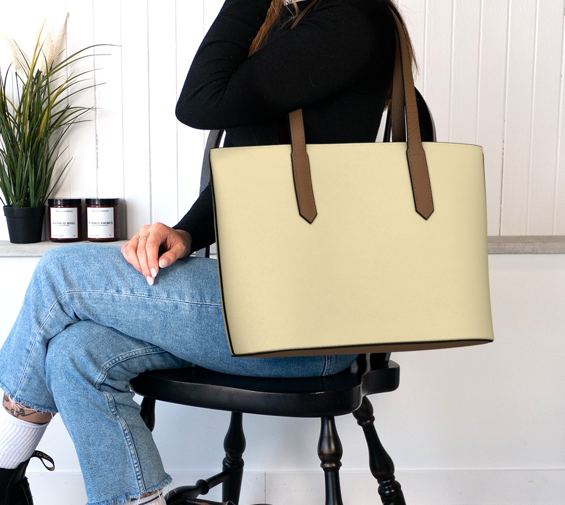 Queen of Petals Champagne Vegan Leather Tote Bag worn on shoulder for everyday carry