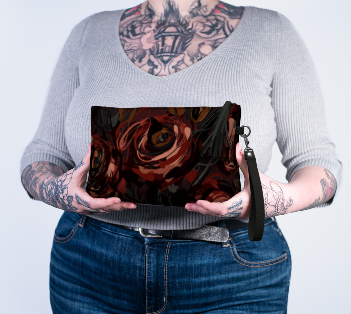 Queen of Petals Château Noir Vegan Leather Clutch worn on wrist with detachable strap
