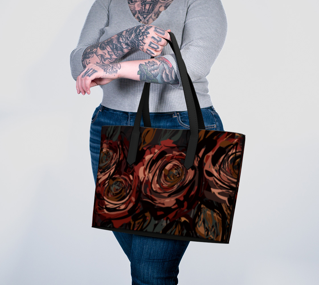 Queen of Petals Château Noir Vegan Leather Tote Bag carried on arm, rust and garnet