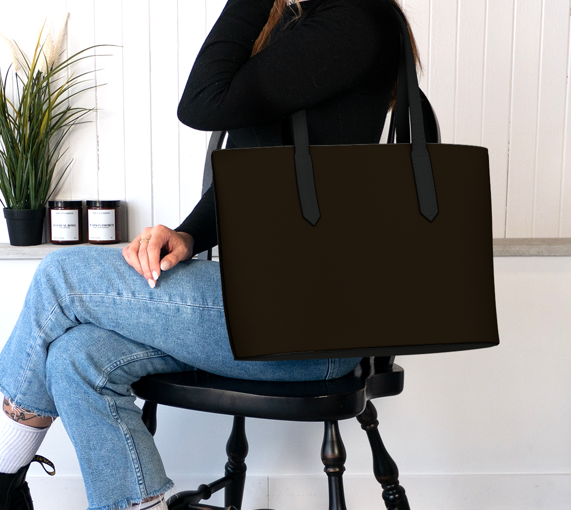 Queen of Petals Chocolate Brown Deep Roasted Tote Bag worn on shoulder with research books inside