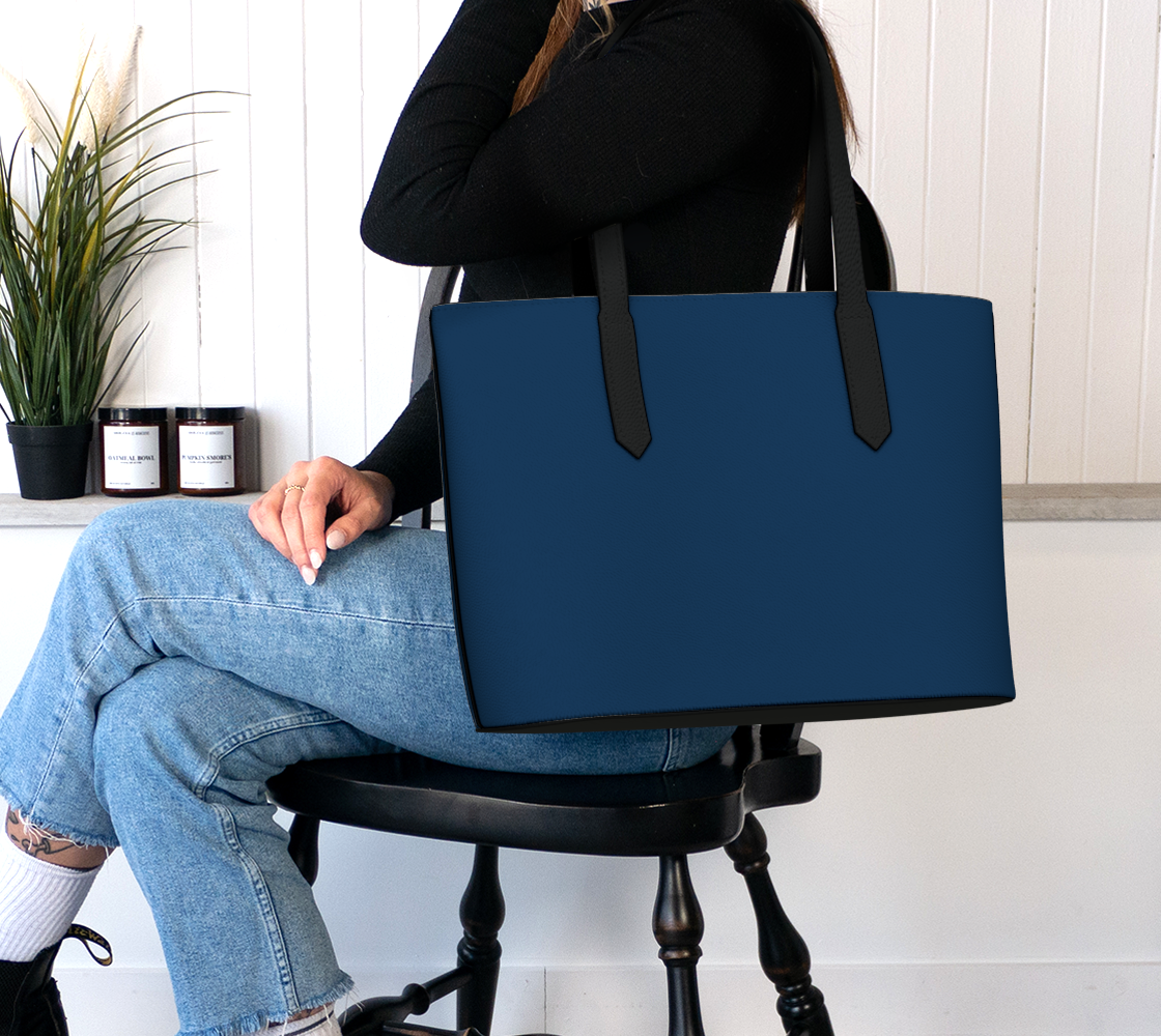 Queen of Petals Indigo Tote Bag worn on shoulder, fits 16 inch laptop, deep indigo vegan pebble leather, professional work tote styling