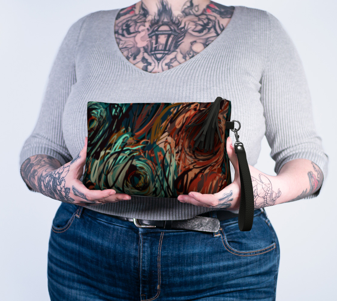 Queen of Petals Patina Clutch held in hands showing 10×6×3 inch size with navy lining
