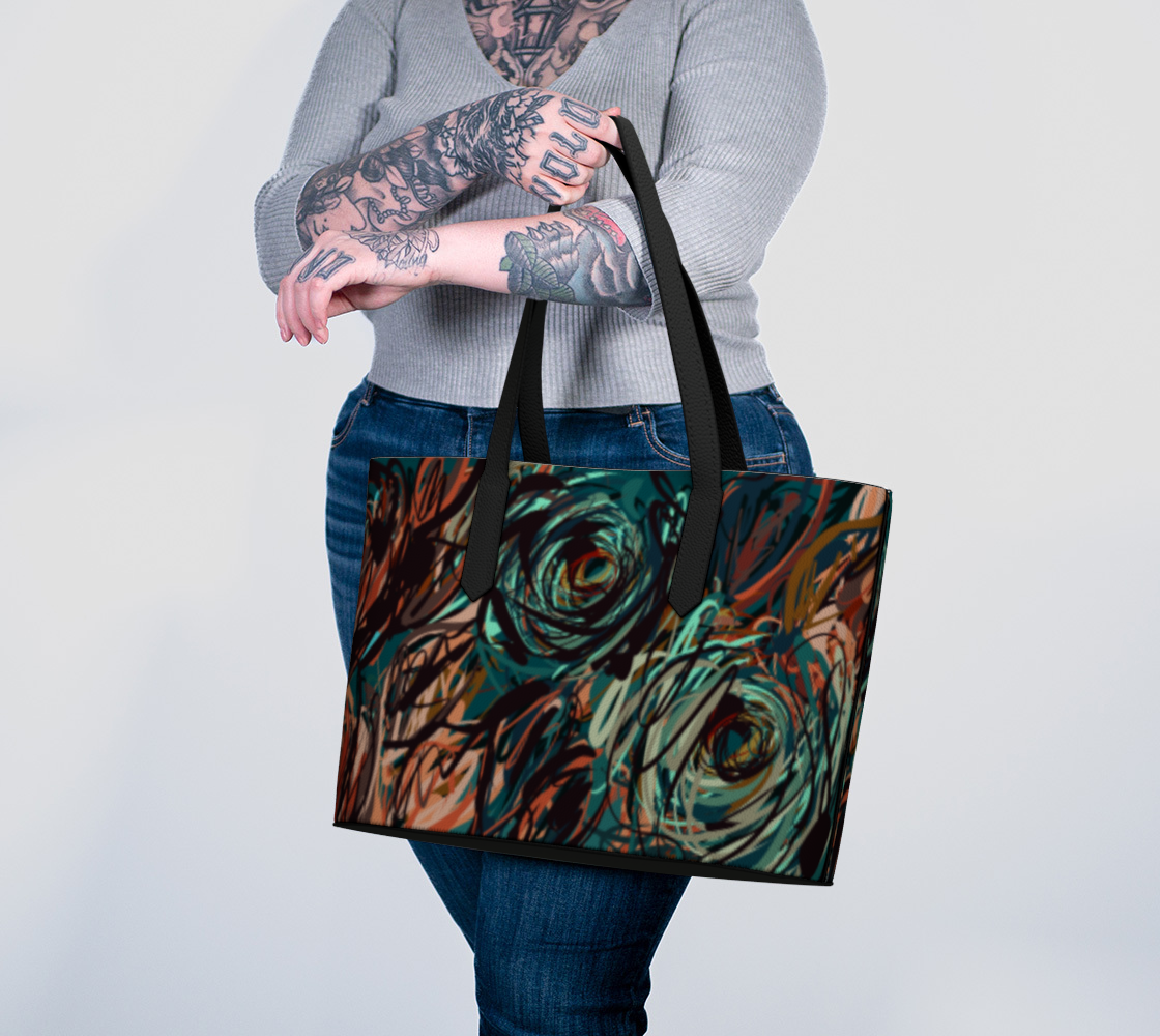 Queen of Petals Patina Tote carried on arm showing oxidized copper and teal print