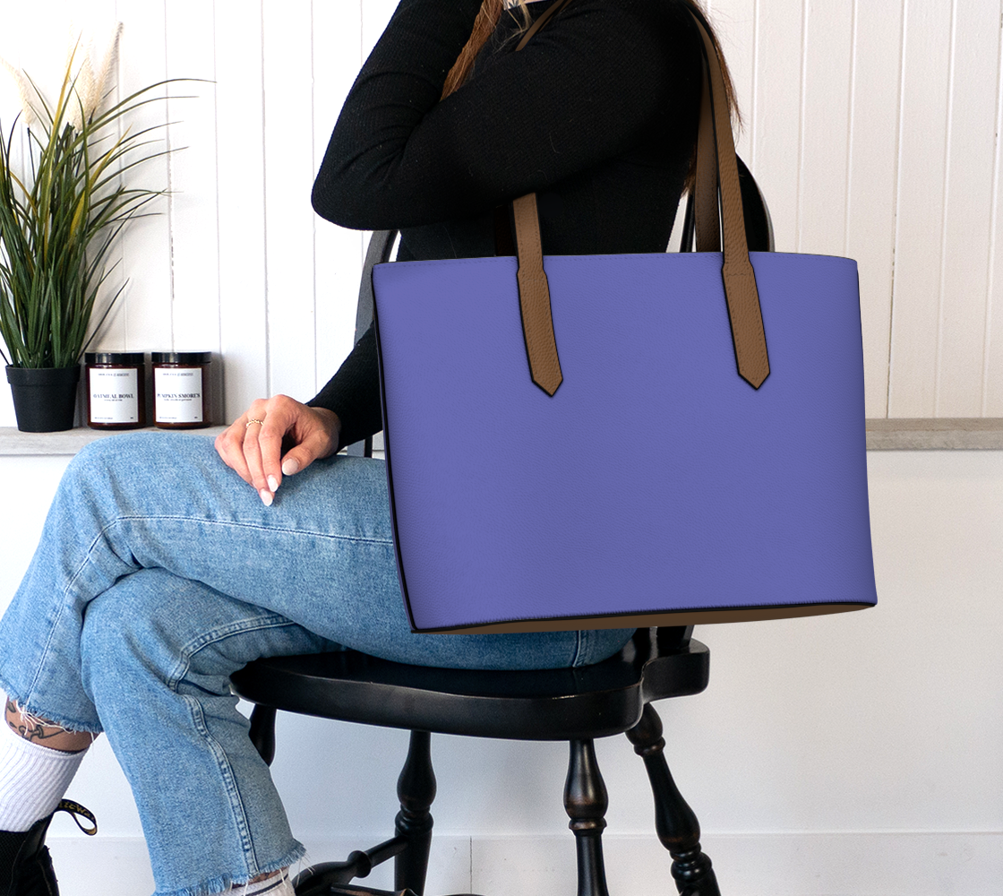 Queen of Petals Periwinkle Resolve Violet Blue Tote, worn on shoulder, violet blue vegan leather with 22" strap
