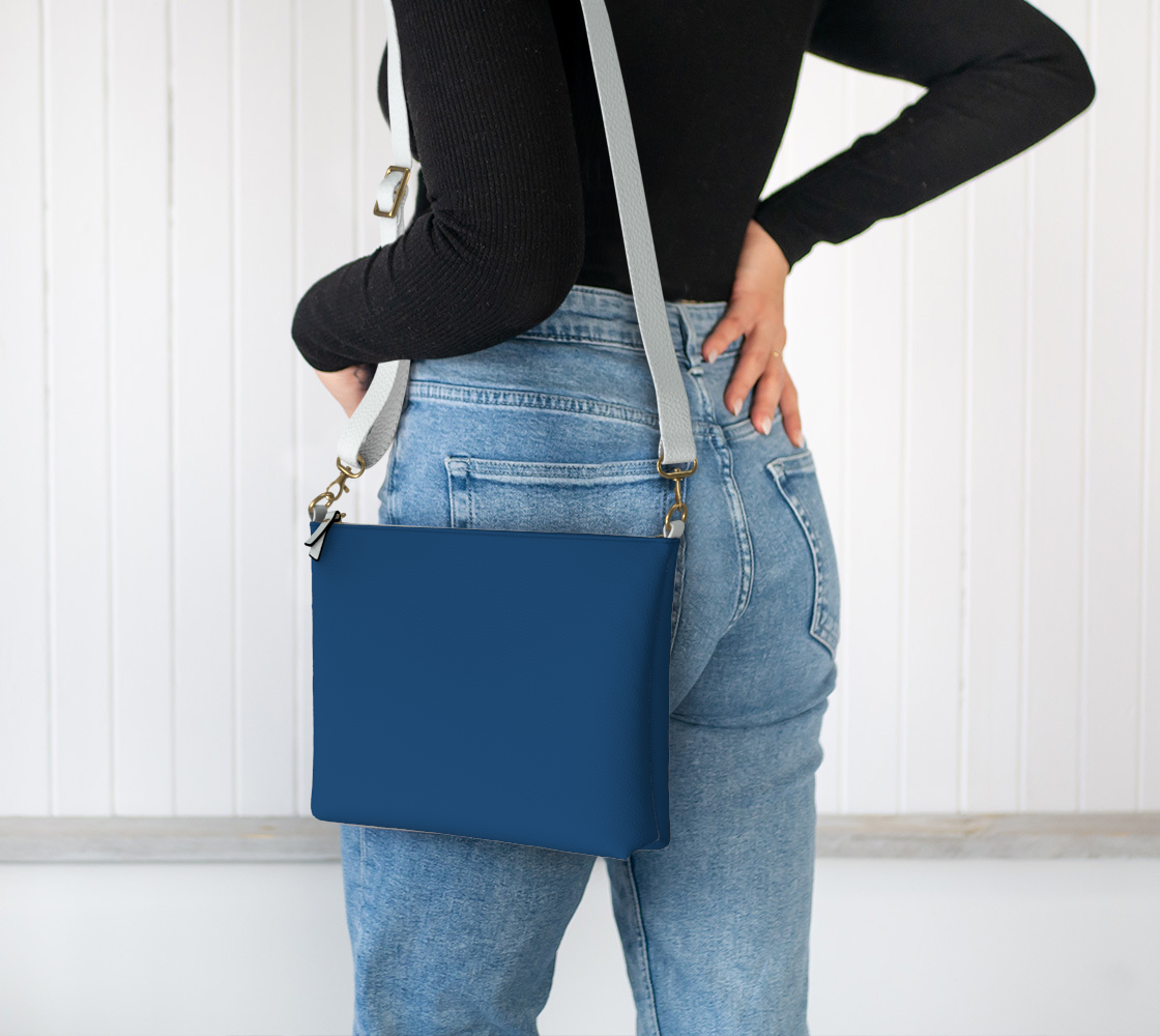 Queen of Petals Royal Blue Crossbody Purse worn on shoulder with adjustable strap, royal blue color, hands-free crossbody bag styling