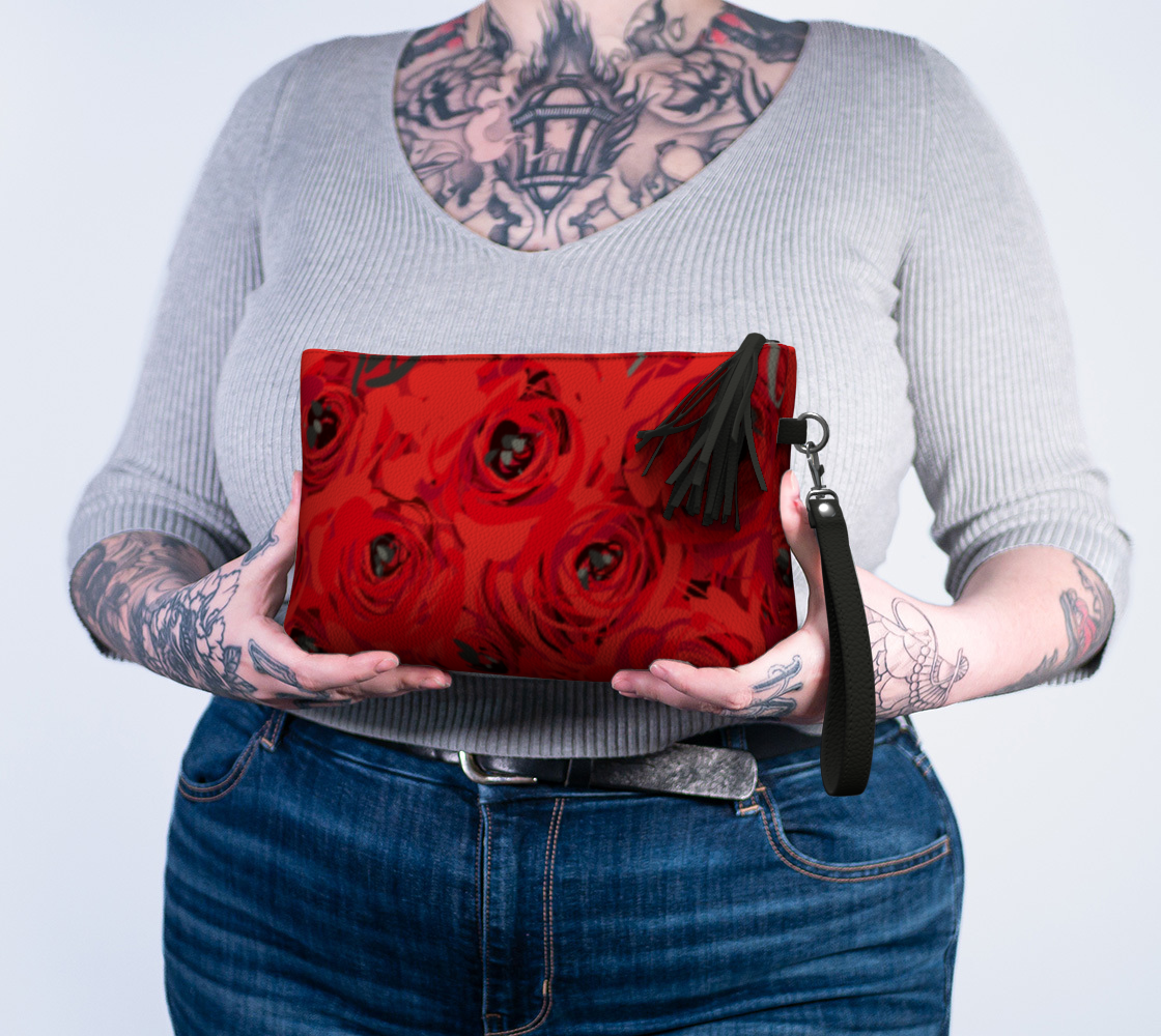 Queen of Petals Ruby Red Roses Vegan Leather Clutch, held in hands demonstrating 10 by 6 inch size