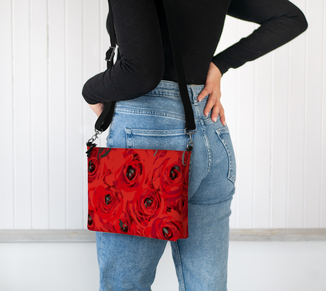 Queen of Petals Ruby Red Roses Vegan Leather Crossbody Purse, worn on shoulder with adjustable strap