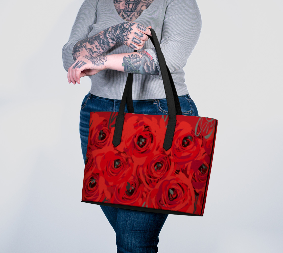 Queen of Petals Ruby Red Roses Vegan Leather Tote Bag, carried on arm, showing handle length