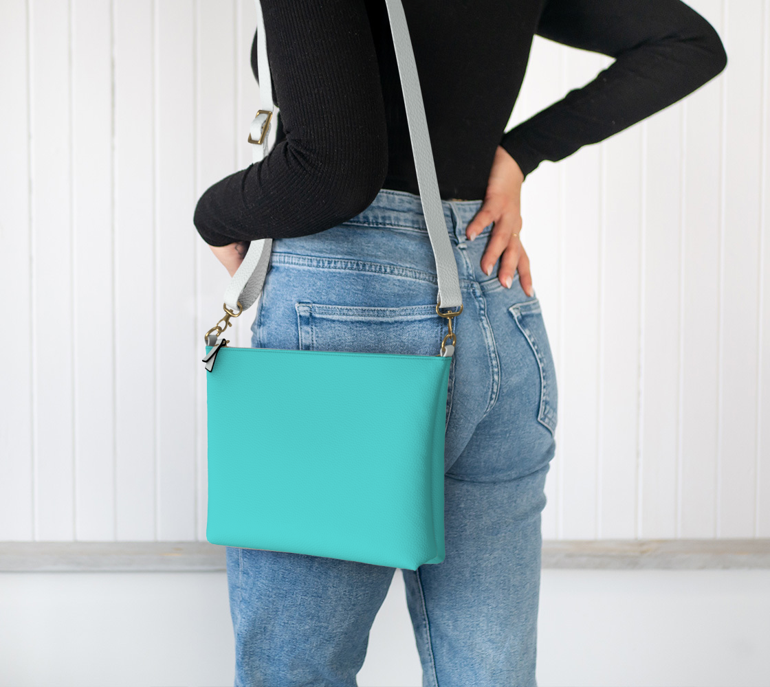 Queen of Petals Sky & Soil Bright Turquoise Crossbody Purse, worn crossbody, adjustable strap