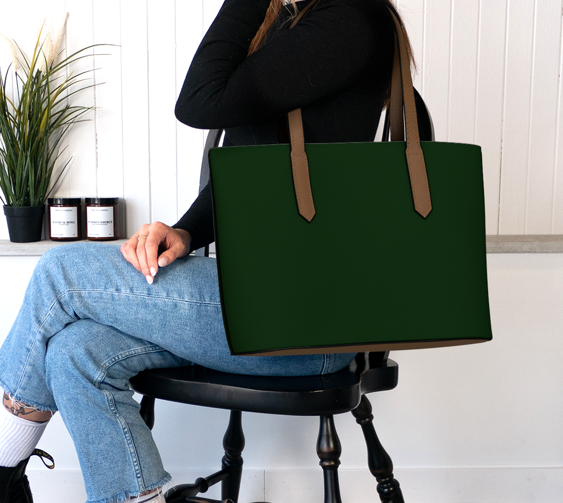Queen of Petals The Cartographer Darkest Forest Tote Bag, worn on shoulder demonstrating hands-free carrying with magnetic snap closure