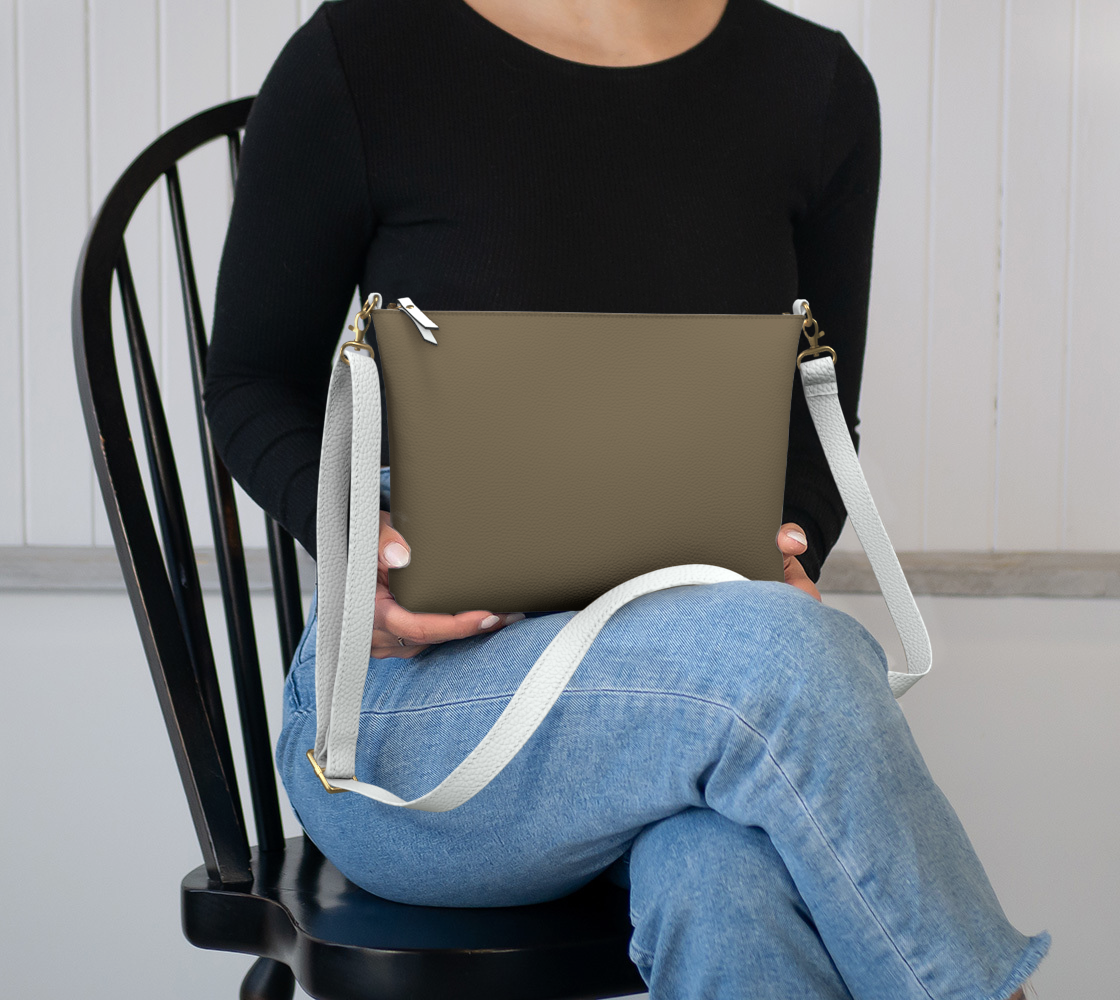 Queen of Petals The Ceramics Kiln Vegan Leather Crossbody, sitting in lap, emphasizing the compact profile.