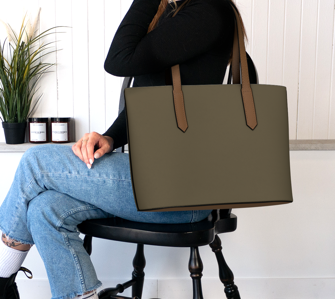 Queen of Petals The Ceramics Kiln Vegan Leather Tote Bag, on the shoulder, styled for a studio day.