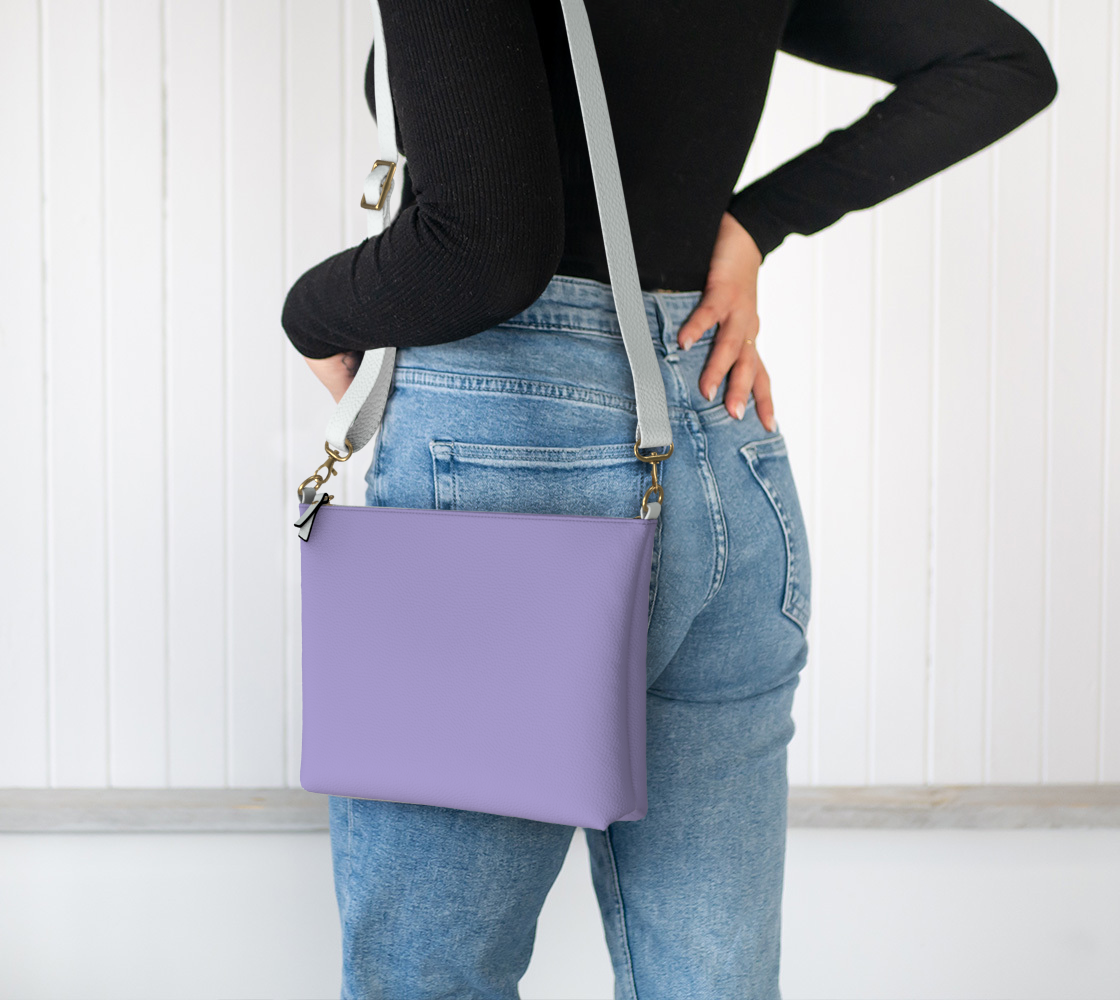 Queen of Petals The Steward Amethyst Crossbody Purse, worn on shoulder, adjustable strap