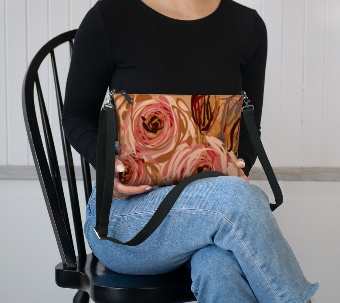 Queen of Petals Vintage Blooms Vegan Leather Crossbody Purse sitting in lap showing compact 8.5 by 7 inch size