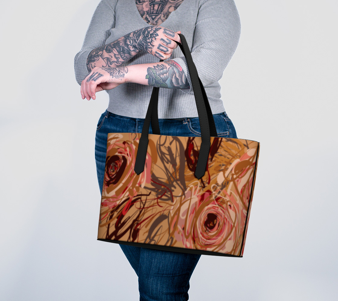 Queen of Petals Vintage Blooms Vegan Leather Tote Bag carried on arm showing lined interior with pockets
