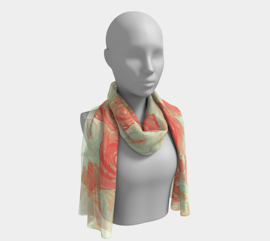Model wearing Xyla long silk scarf wrapped elegantly around neck, showcasing coral and apricot floral print with soft draping