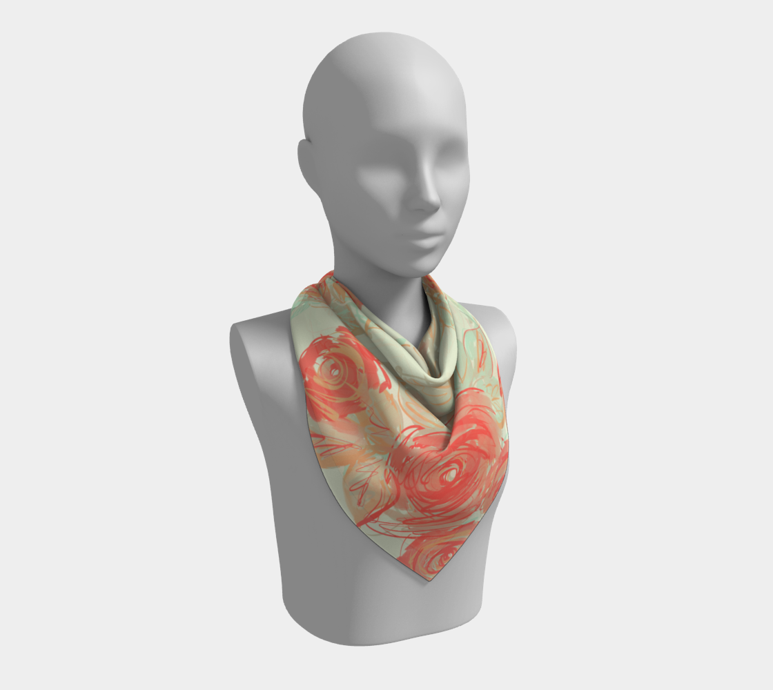 Model styling 26x26 Xyla square silk scarf in classic neck wrap, displaying painterly coral roses with mint accents