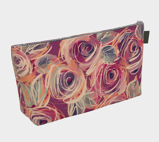 Side view of Zenith Rose makeup bag showing zipper, depth, and vegan leather pull tab.