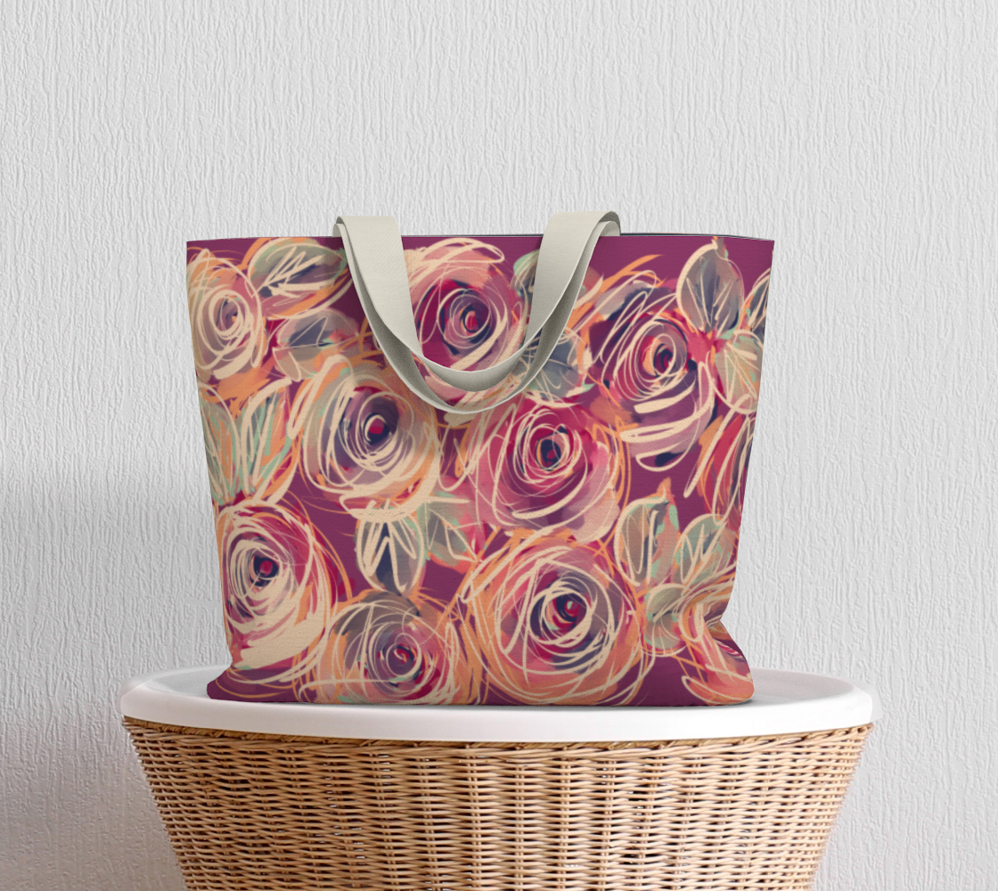 Zenith Rose Sovereign Tote Bag resting on a wood table, featuring an oversized structured design, thick cotton straps, and bold hand-painted floral print in coral and berry hues. A carryall for creatives and queens who take up space unapologetically.