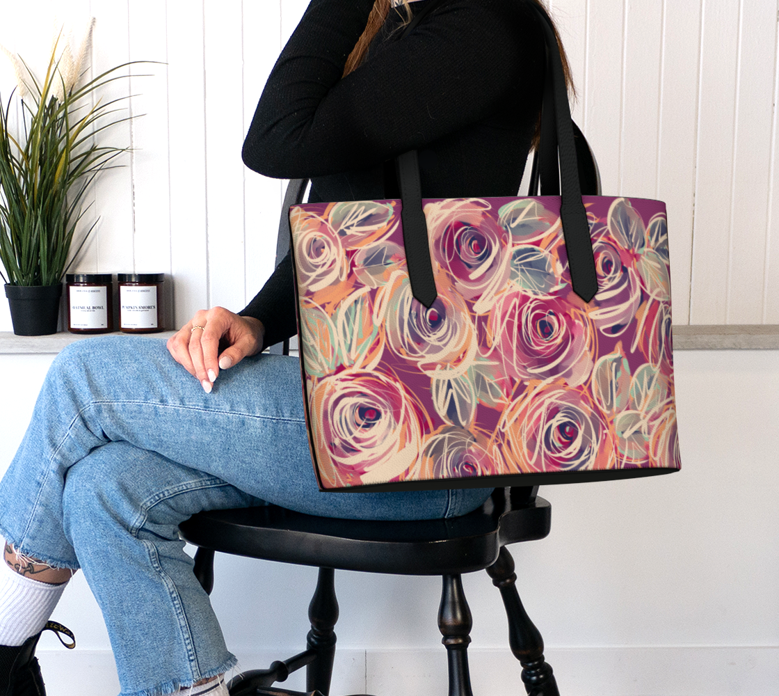 Woman wearing the Zenith Rose tote with black straps over her shoulder, dramatic floral print contrasting against minimalist fashion.