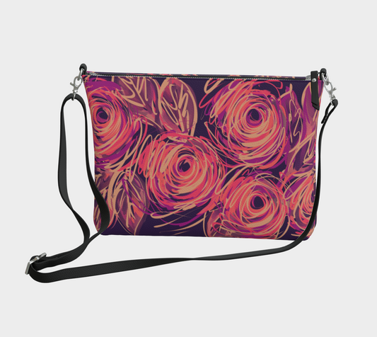 Yvaine Crossbody Purse front view showing swirling abstract roses in buff, coral, fuchsia and deep violet on smooth vegan leather